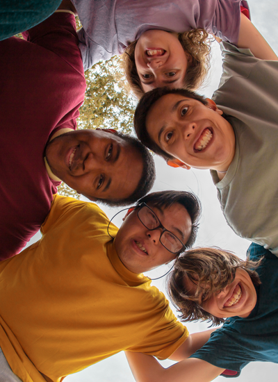 Supportive group of children in a huddle – small group tutoring and social-emotional learning for elementary students with mild to moderate disabilities