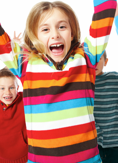 Child celebrating academic success – tutoring that boosts self-esteem and fosters independent learning in students with ADHD and learning differences